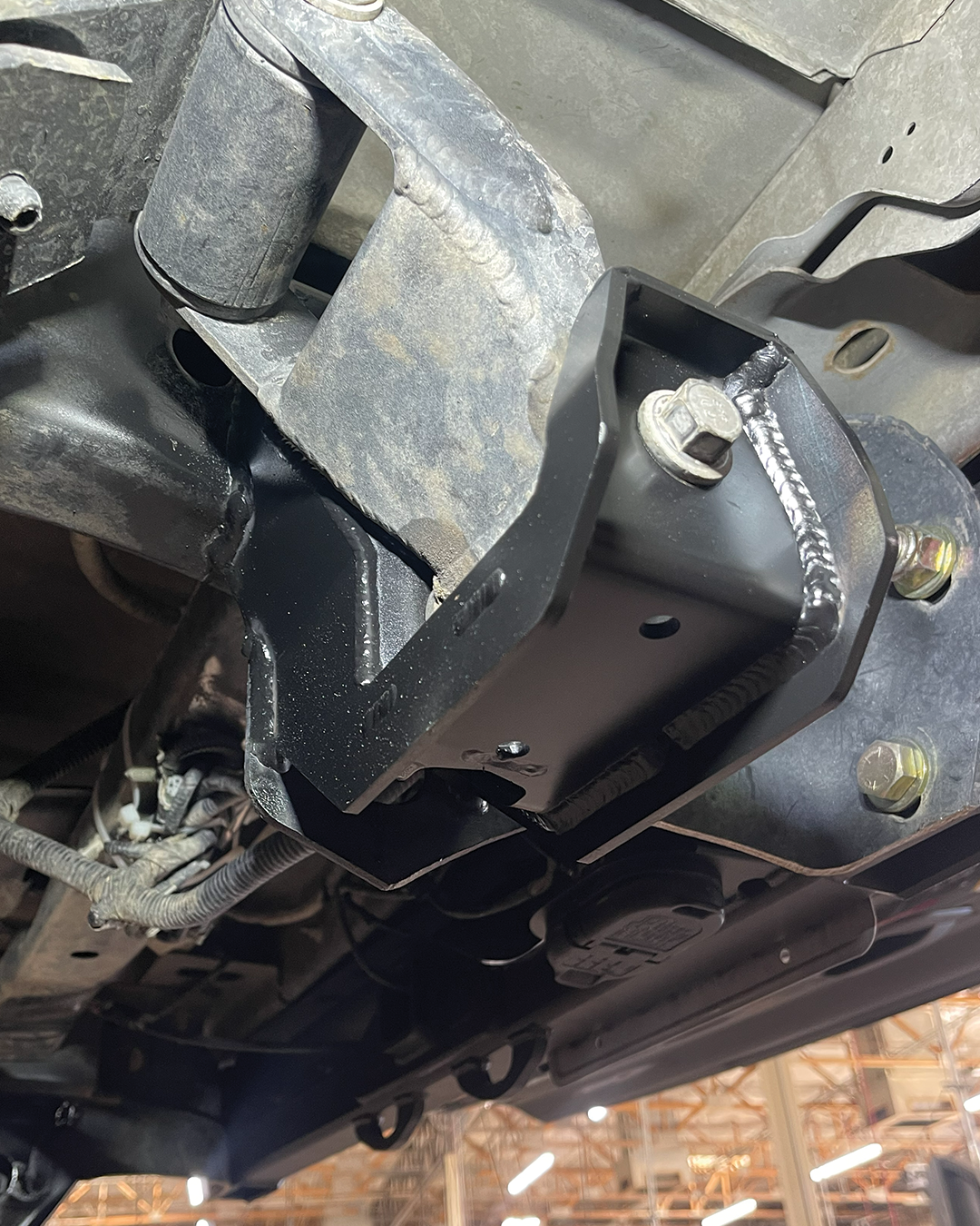 Close up Fabricated Rear Shackle Hanger installed on Gen 1 Raptor