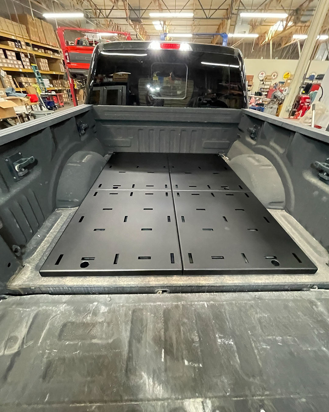 2017-2026 Ford Raptor and 2015+ F-150 rear bed deck plate add-on kit installed in truck bed