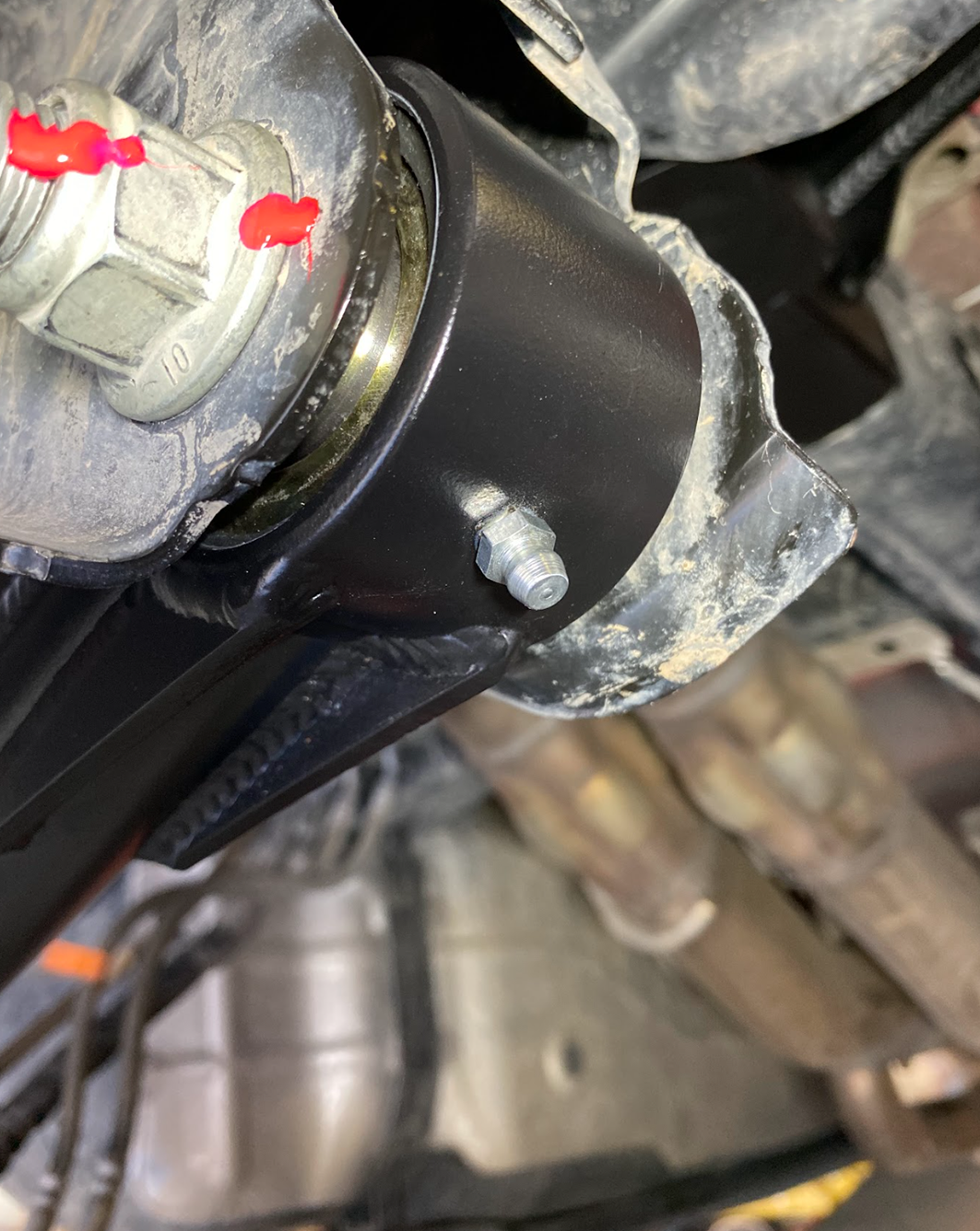 Extreme close up of the forged Johnny Joint housing and urethane liner used on the Ford Raptor adjustable panhard bar