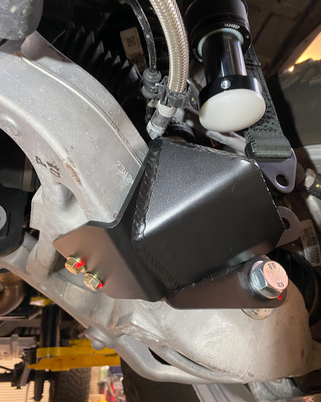 mounting bracket on Stock lower arm Front Limit Strap with Bump Stop Stock for 2021-2024 Ram TRX suspension