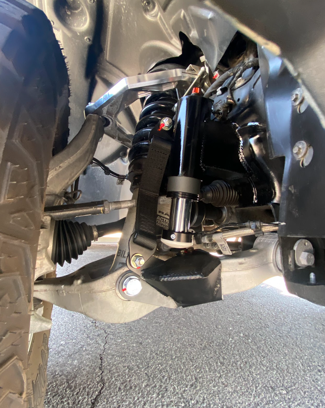 Front Limit Strap with Bump Stop on a 2021-2024 Ram TRX suspension