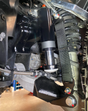 2025 Ram RHO Front Limit Strap & Bump Stop installed on a Stock Lower Arm