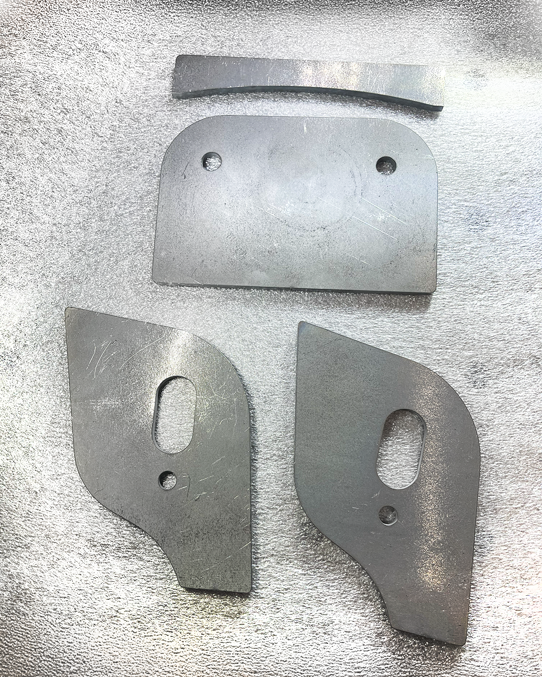 Weld-on 4130 steel lower control arm pocket reinforcement brackets with dual drain holes