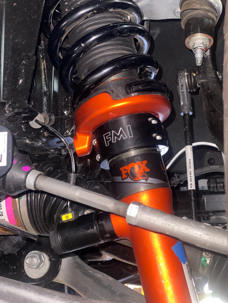 Foutz Motorsports spring perch lift collar installed on the factory front coilover of a Ford Ranger Raptor