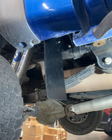 Ford Raptor frame-mounted rear shock guard protecting aftermarket suspension