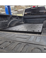 Side view of the Simple Bed Organizer deck plates running back to the tailgate of a Ford Super Duty