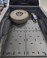 Ford Super Duty bed organizer complete kit carrying a spare tire and jack on the steel deck