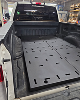 Angled view of the complete Simple Bed Organizer Kit installed in a Ford Super Duty truck bed