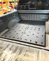 2017-2026 Ford Raptor and 2015+ F-150 rear bed deck plate add-on kit installed in truck bed