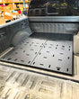 2017-2026 Ford Raptor and 2015+ F-150 rear bed deck plate add-on kit installed in truck bed