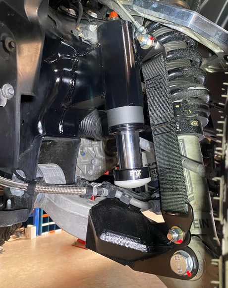 2025 Ram RHO Front Limit Strap & Bump Stop installed on a Stock Lower Arm