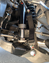 drivers side of 2025 Ram RHO with a Front Limit Strap & Bump Stop installed on a Stock Lower Arm