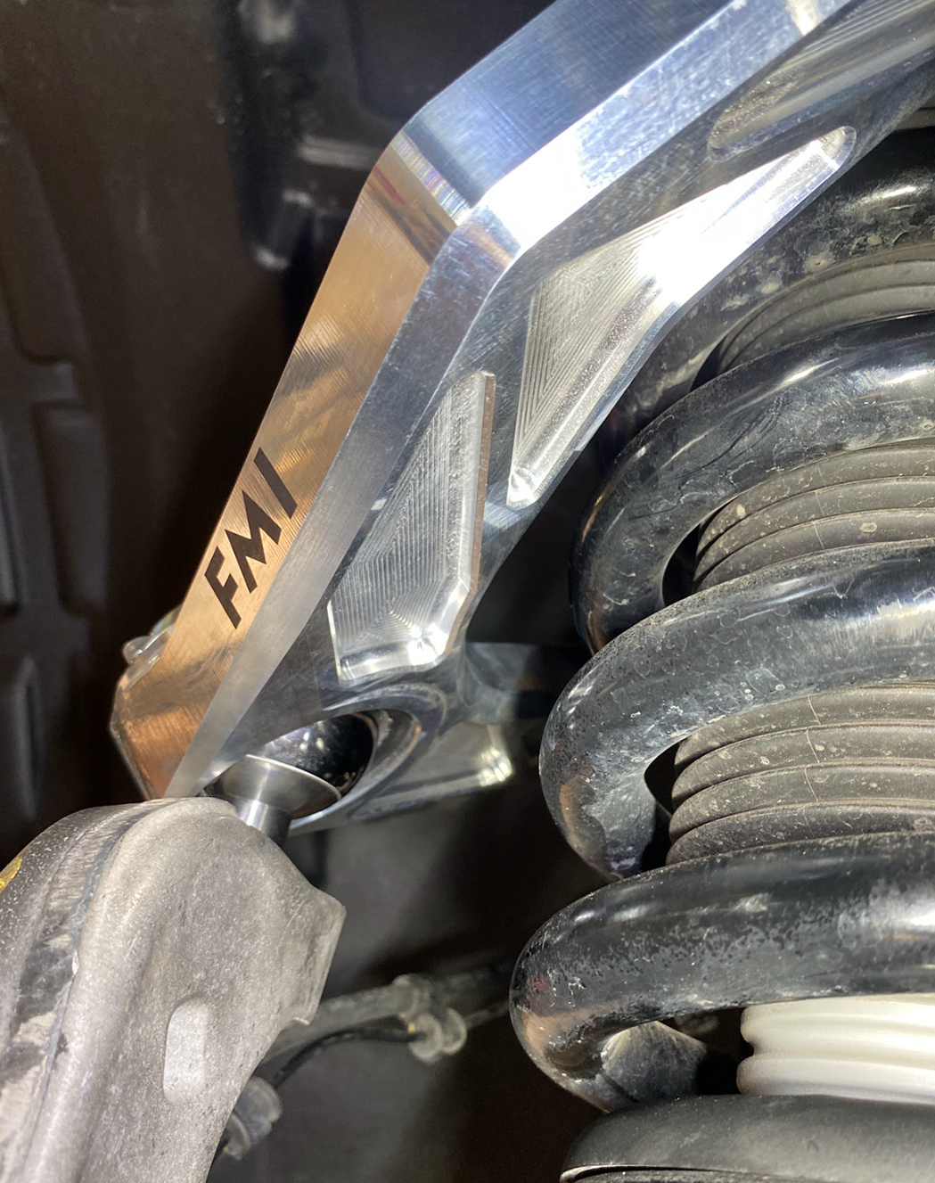 close up of billet upper control arms on a 2027 Ram 1500 SRT TRX