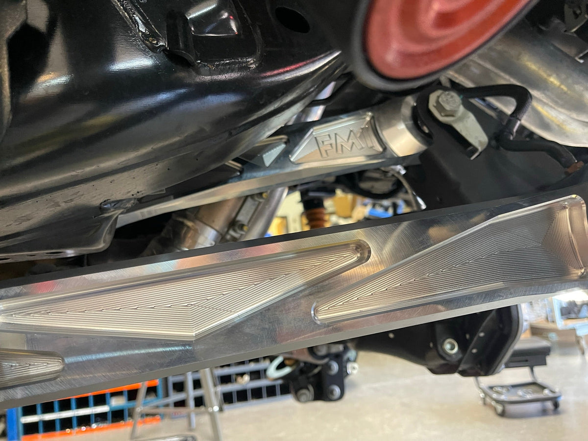 Machined pocket detail on a raw billet Bronco Raptor rear arm, close view from below