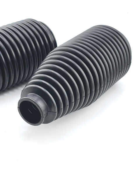 Close-up of ribbed urethane tie rod boot bellows that seal the steering rack on Foutz Motorsports billet tie rod kits