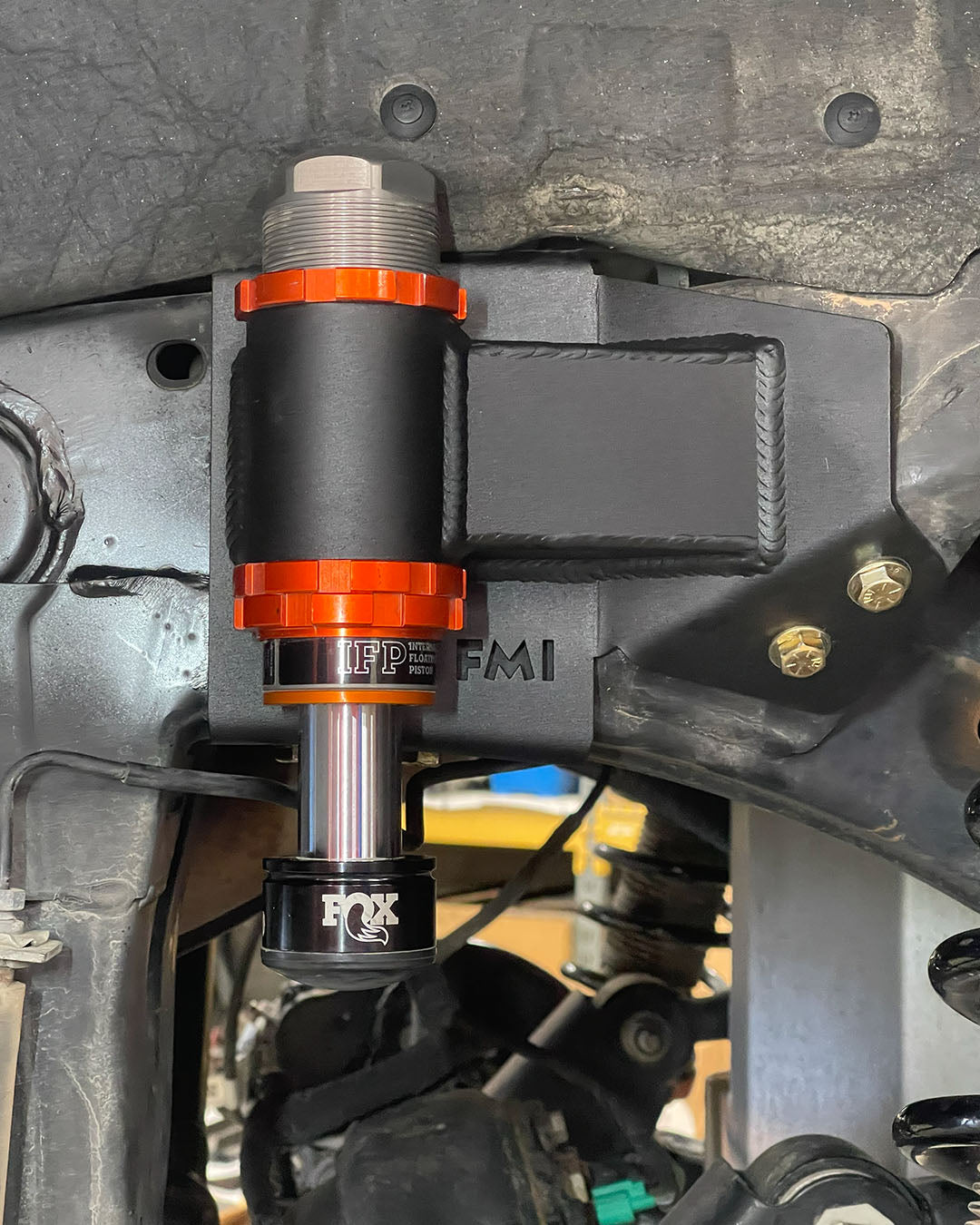 Ranger Raptor rear bump stop kit close-up on mig welded powder coated frame mount
