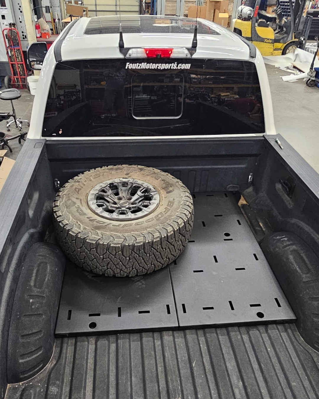  Super duty bed organizer with main section deck plates installed with spare tire 