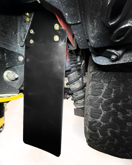 Ford Bronco Raptor mud flap kit installed for off-road tire debris protection