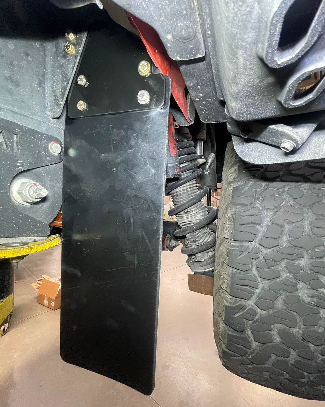 Bronco Raptor mud guards reducing rock chips and debris from aggressive tires, protects rear mid travel suspension system 
