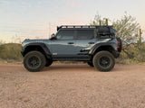Full side view of a Ford Bronco Raptor lifted on Geiser Off-Road progressive coil springs