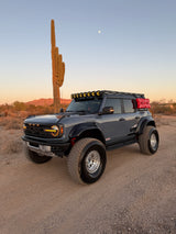Ford Bronco Raptor front view in the desert on Geiser Off-Road front and rear progressive lift springs