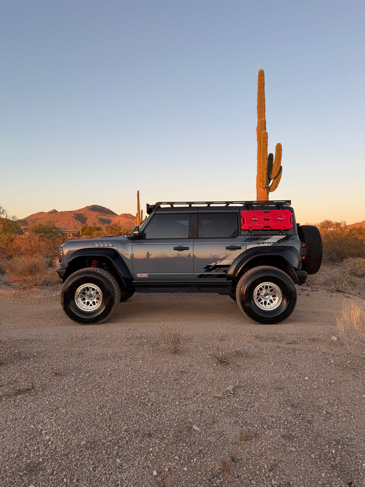 Side profile of a lifted Ford Bronco Raptor on Geiser Off-Road progressive springs showing the raised stance