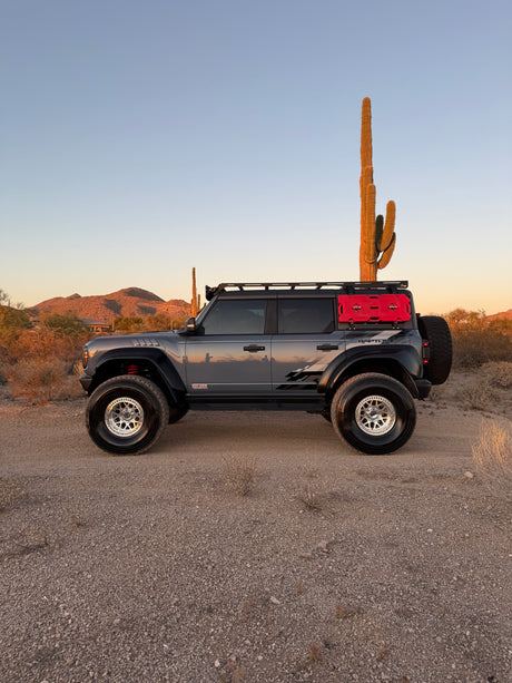 Side profile of a Ford Bronco Raptor showing rear ride height on Geiser Off-Road progressive rear springs