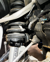 2.5" lift collar installed on a Ram RHO with adjustable ride height sensor connector rods
