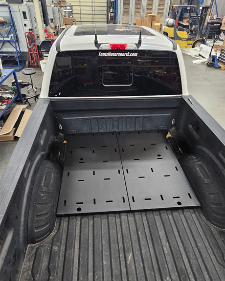 Simple Bed Organizer main section deck plates installed at the front of a 2017-2026 Ford Super Duty bed